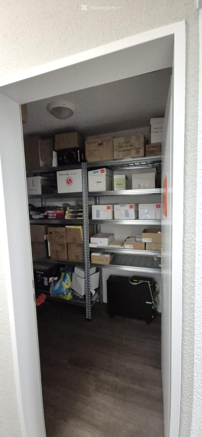Storage room with shelves, boxes, and items