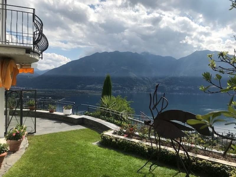 house balcony overlooking lake and mountains