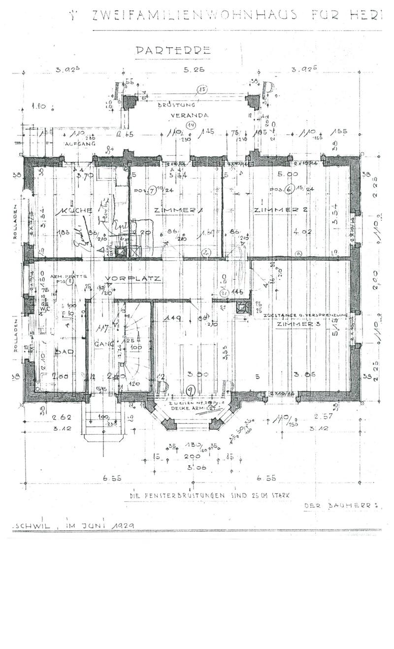 Floor plan of a two-family house, showing the ground floor layout with labeled rooms including kitchen, living room, bedrooms, and bathroom.