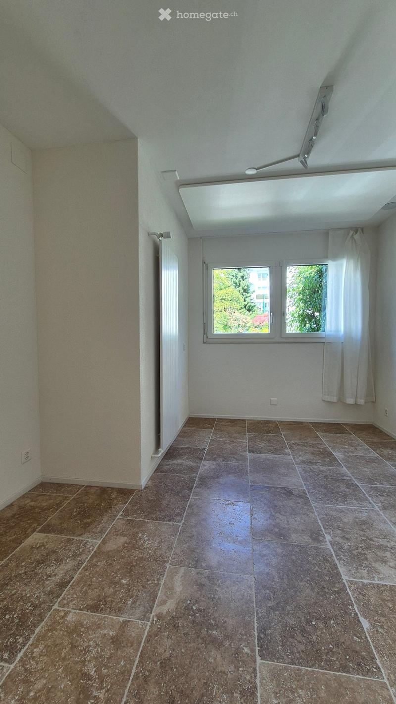 empty room, light brown tiles, white walls, windows
