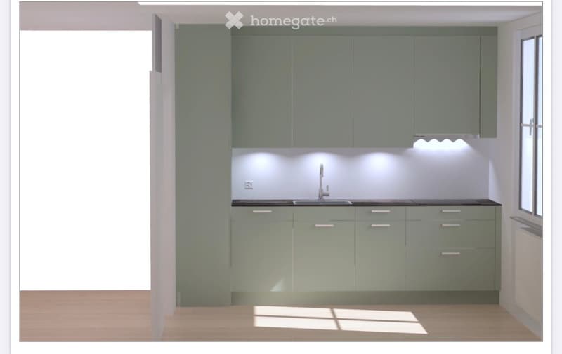 Modern kitchen with grey cabinets, white walls, and a black countertop. Features a sink with a faucet and built-in lighting above the counter.