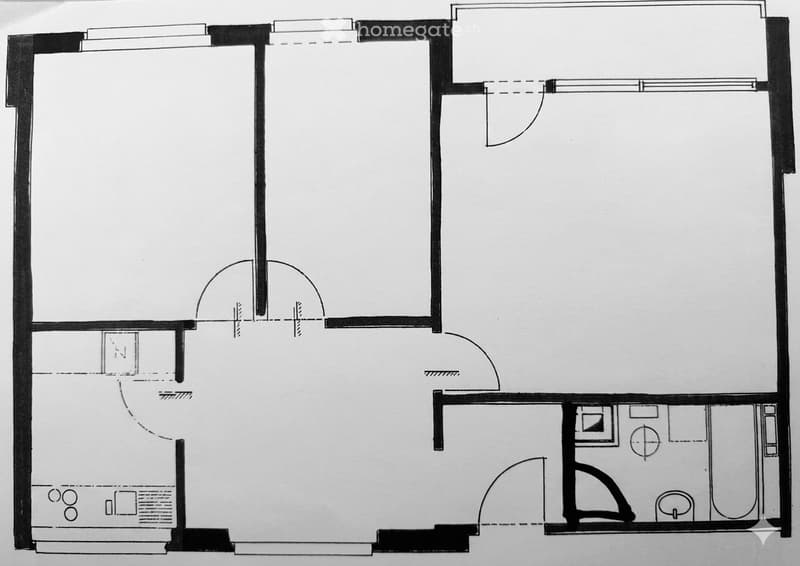 Floor plan of a compact apartment featuring a living area, kitchen, bedroom, and bathroom. Layout includes an entryway, small hallway, and a compact kitchen area.