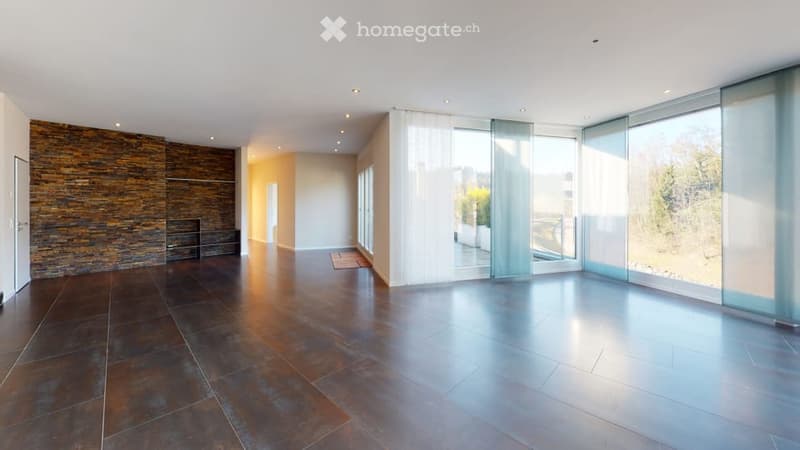 tiled floor, large windows, glass doors to balcony, stone wall