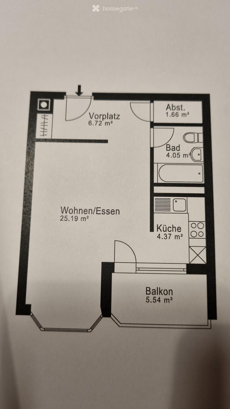 Floor plan of a compact apartment with a living/dining area, kitchen, bathroom, hallway, and balcony.
