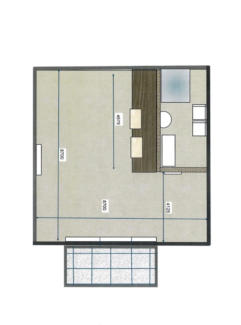 Layout of a studio apartment with a small kitchen area, bathroom, and living space.