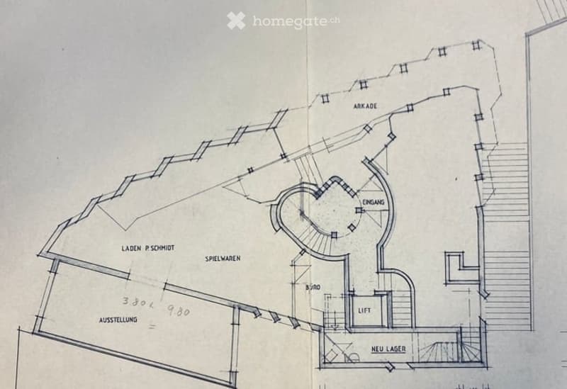 Floor plan of a commercial space with labeled areas including entrance, arcade, new storage, lift, and display areas.