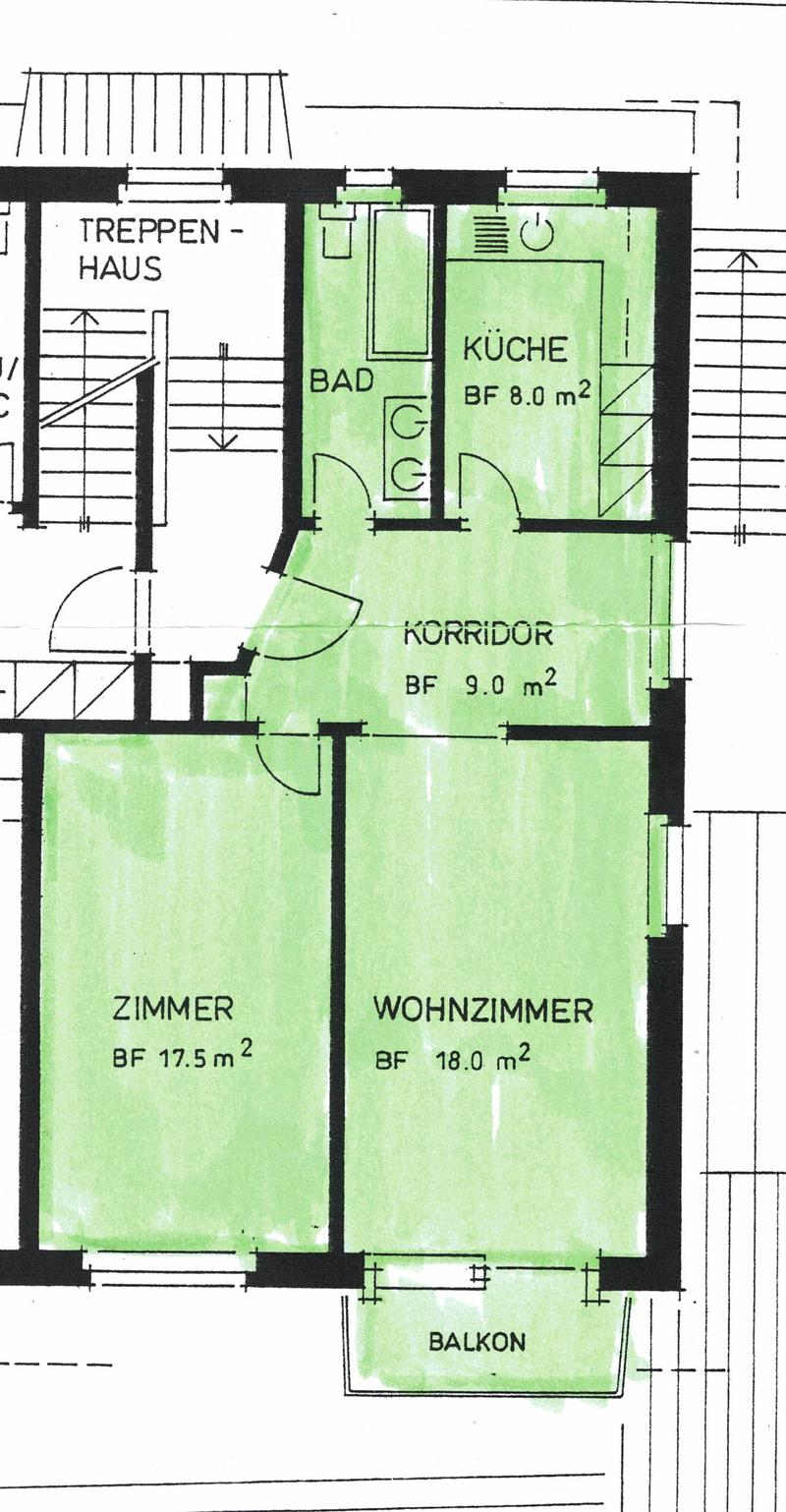 Floor plan of a house with a staircase, living room, bedroom, kitchen, bathroom, and balcony.