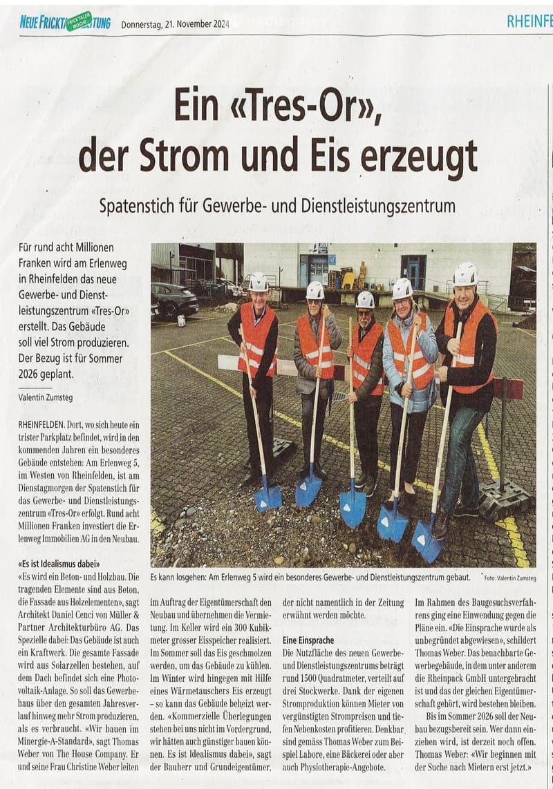 Newspaper page featuring a headline about a new commercial and service center being built, with a photo of five people holding shovels in front of a construction site.