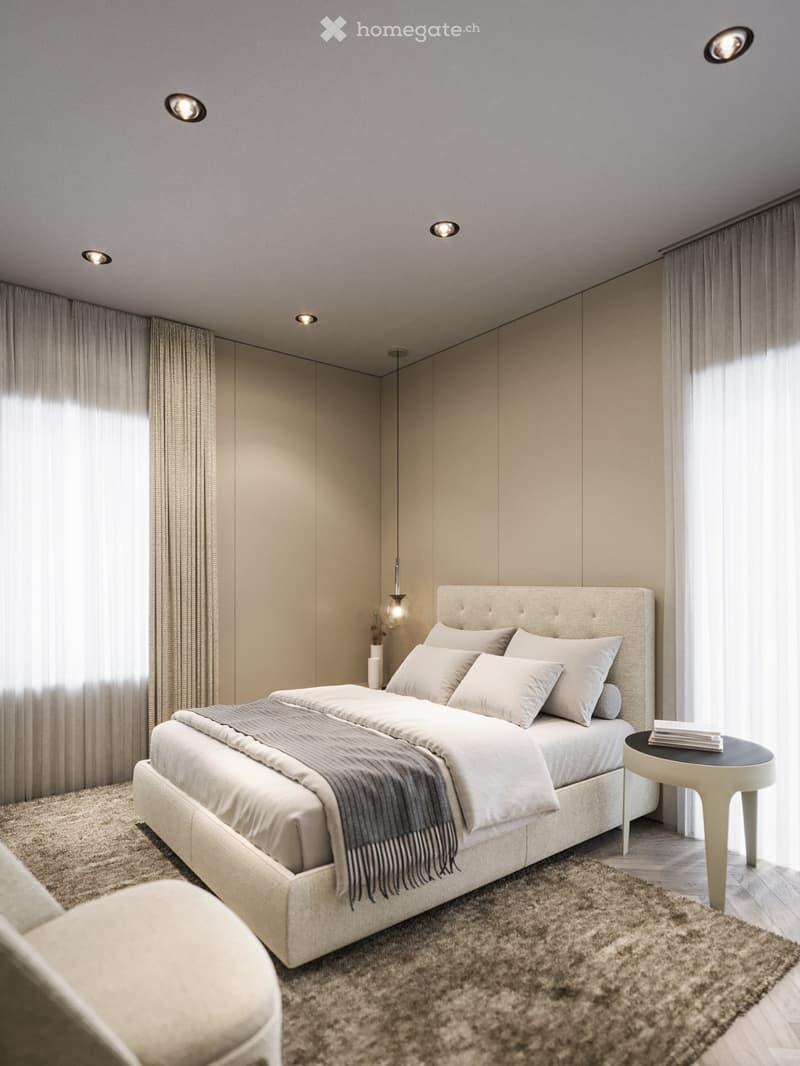 King-size bed, nightstand, cozy armchair, beige carpet, neutral wall colors, ceiling lighting, pendant lamp, large windows with white curtains