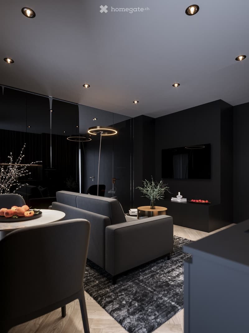 Interior with black walls, grey couch, table, TV, carpet