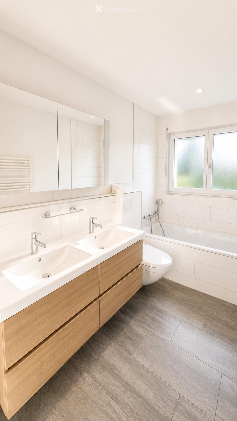Modern bathroom with double sink, wooden vanity, bathtub, toilet, large mirror, and frosted glass window.