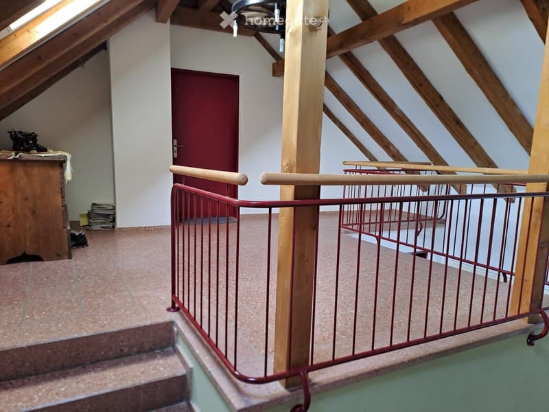 loft space, wooden beams, staircase, red railing, open attic