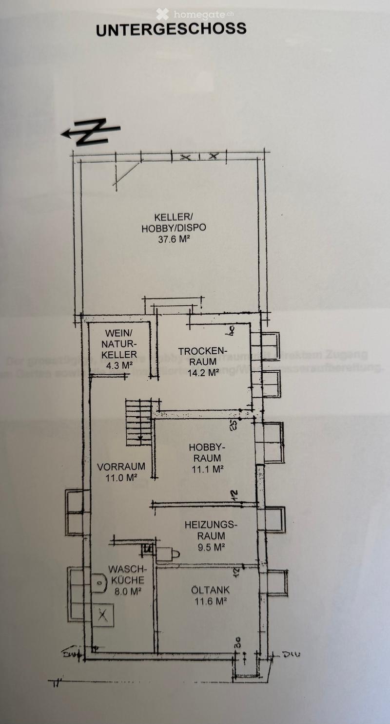 Layout of the basement level showing multiple rooms including a hobby room, wine cellar, storage space, heating room, and utility kitchen.