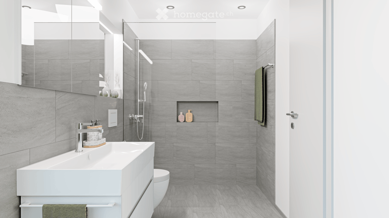 modern bathroom, gray tiles, white vanity, shower with glass enclosure, green towel hanging, sink with faucet and toiletries