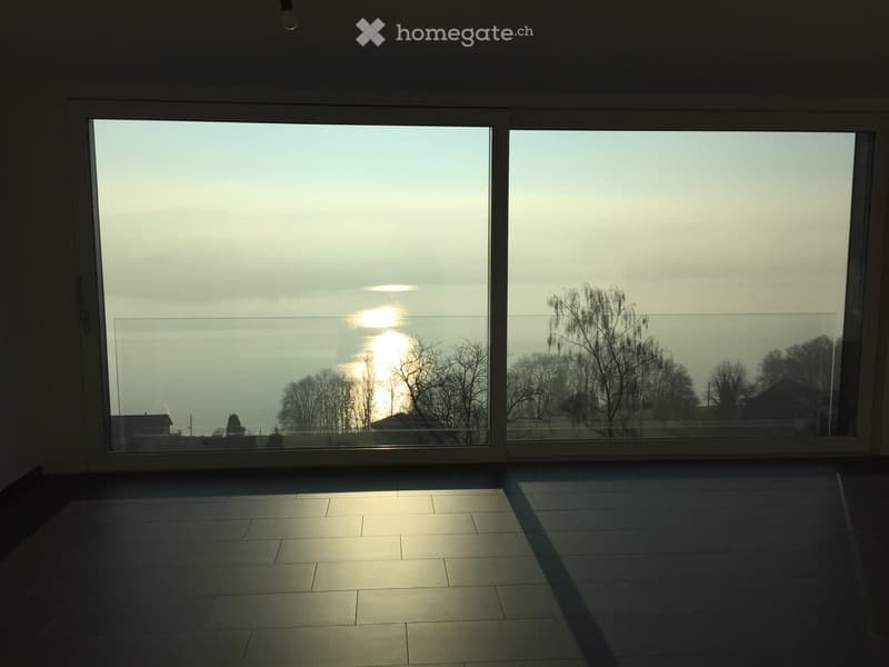 large floor-to-ceiling windows with a panoramic view, modern tile flooring, contemporary design