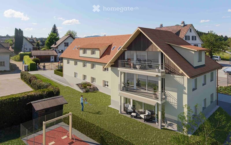 A modern two-story house with a red-tiled roof, large windows, and balconies. The house is surrounded by a well-maintained lawn, garden, and a small playground area.