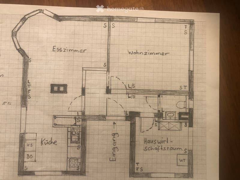 Floor plan showing a house layout with labeled rooms including entrance, living room, bedroom, kitchen, and bathroom.