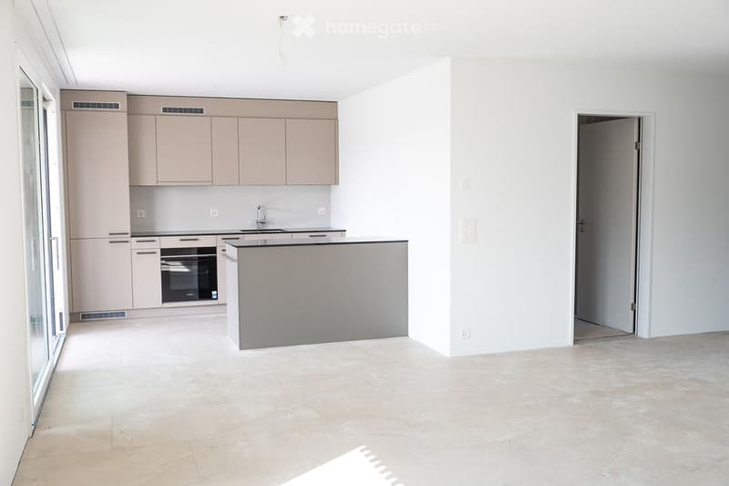 modern kitchen with island, white cabinets, tiled floor, built-in oven, dishwasher, washing machine