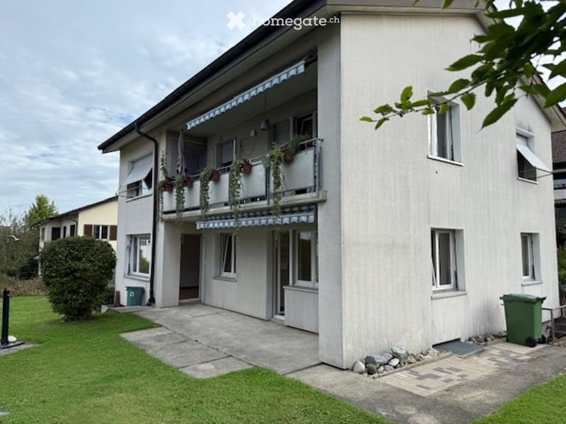 Two story house, balcony, garden, paved entrance