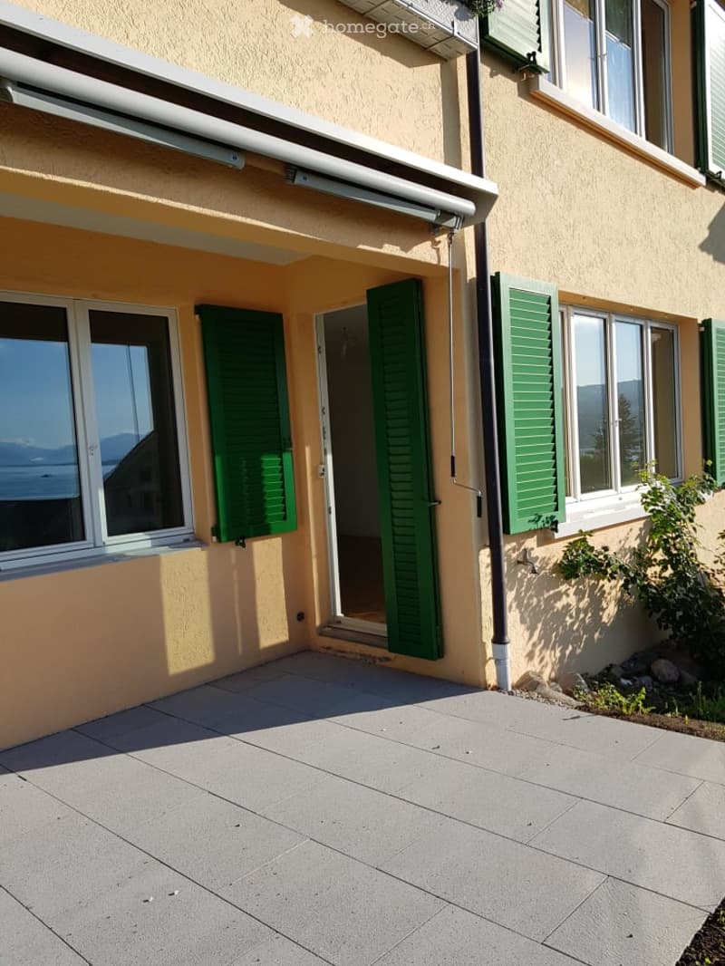Balcony / Terrace. Balcony with tiled floor, green shutters, and a view of the surrounding area.