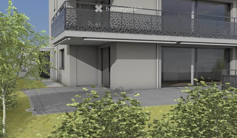 Modern two-story building with a balcony, large windows, and a paved entrance area.