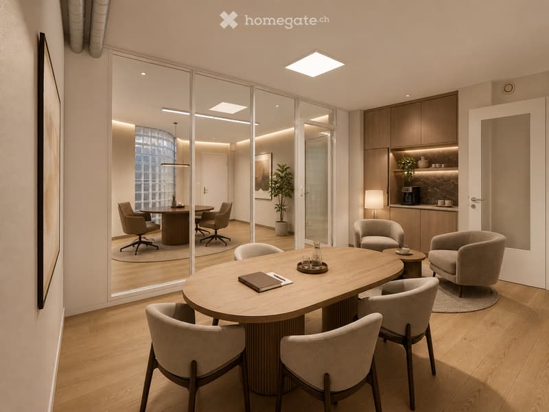 Modern office or meeting room with a large round wooden table surrounded by chairs, a smaller round table with a cup and bottle, a plant, and a coffee machine in the background.