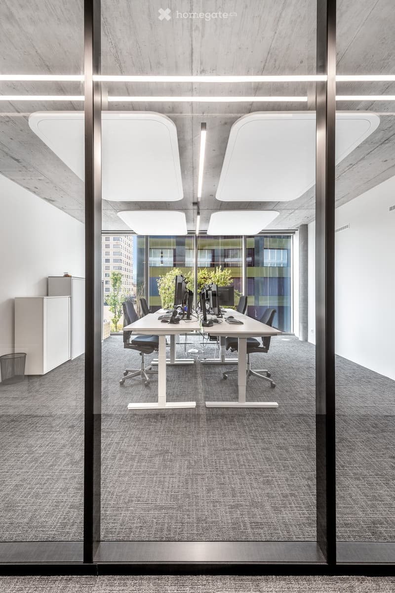 conference room, white desk, black swivel chairs, monitor, gray carpet, glass wall, cabinets