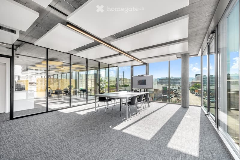Contemporary design with glass walls, white ceiling, modern furniture, large windows with city view