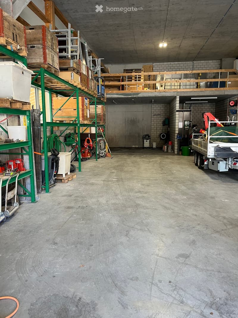 storage room, metal shelves, stacked boxes, industrial equipment, storage box, ladders, trolleys, storage boxes, a truck parked