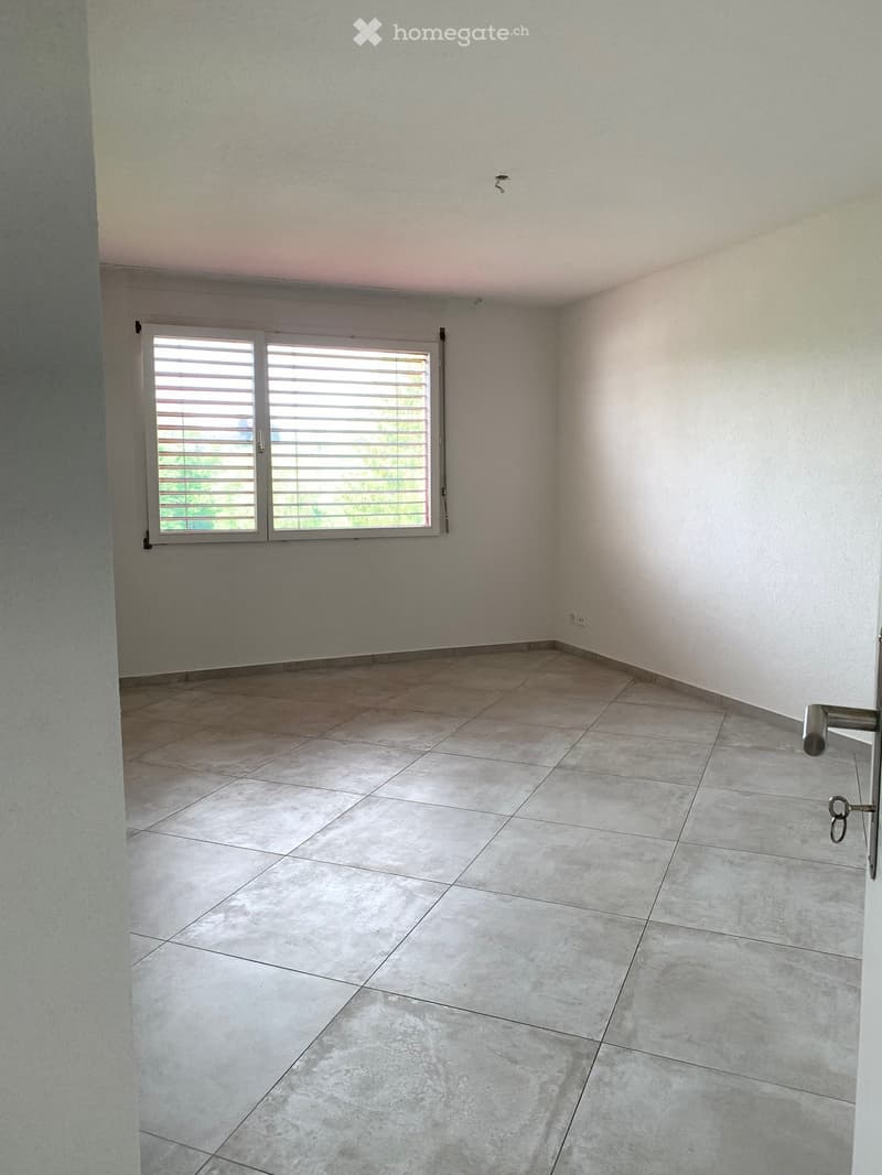 empty room, tiled floor, white walls, window with shutters, no furniture