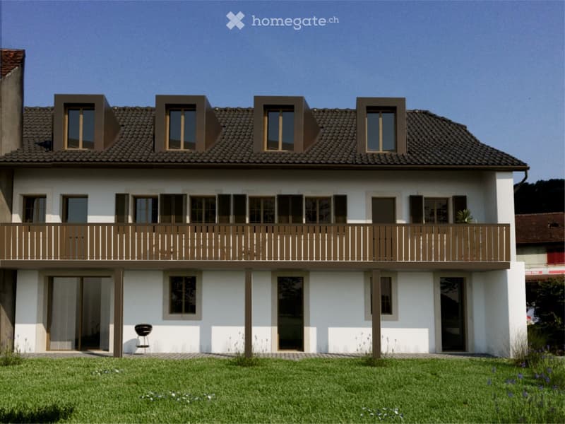 Two-story house with white exterior, brown roof, multiple windows, and a balcony on the upper level.