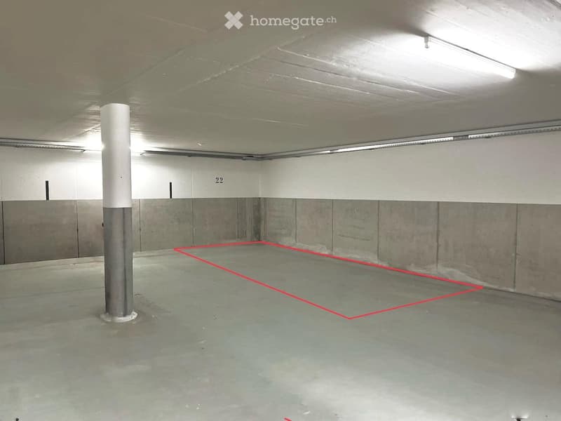 {"type": "Parking place", "description": "Empty underground parking space with concrete floors and walls, marked parking spot, and a central support pillar.", "localized_descriptions": {"EN": "Empty underground parking space with concrete floors and walls