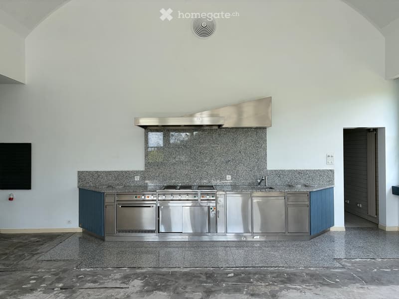 Modern kitchen with stainless steel appliances, granite countertops, and a sleek design.
