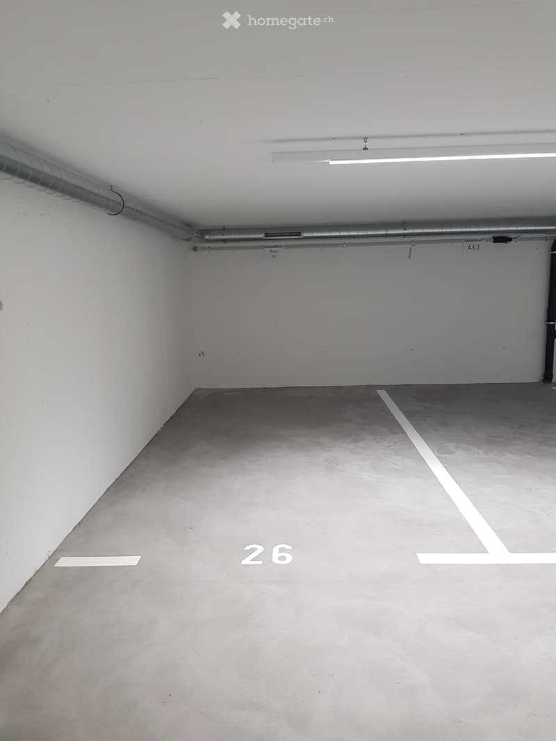 Empty room with bare walls and concrete floor, no furniture or equipment.