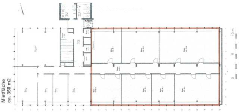 Floor plan of a commercial or industrial space with multiple rooms, including a large central hall, smaller rooms, and a separate entrance area.