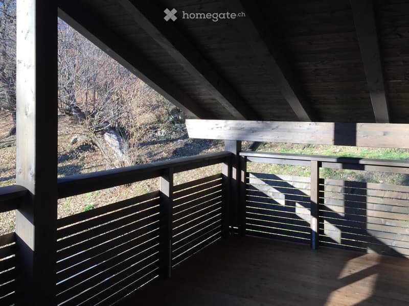 balcony with wooden slat fence, wooden floor, open area