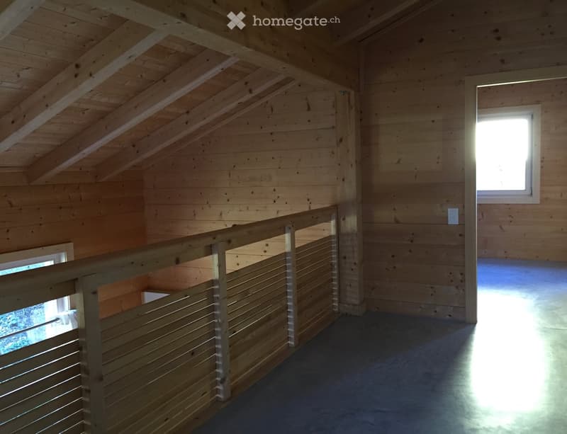 balcony with wooden railing, wooden walls, ceiling with wooden beams, windows