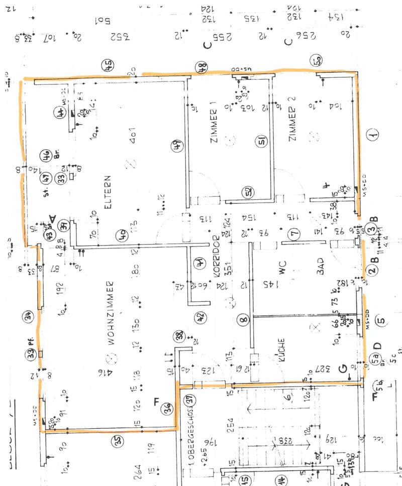 Floor plan of a residential building with multiple rooms including living room, kitchen, bedrooms, and bathrooms. Dimensions and room labels are indicated.