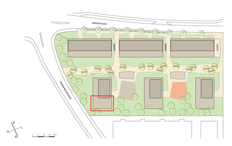 Floor plan of a residential area showing multiple buildings, parking spaces, and green spaces. The highlighted area indicates a specific building location.