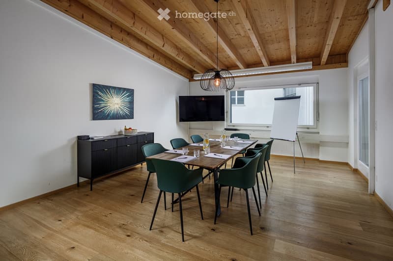 modern meeting room with wooden floor, white walls, wooden ceiling, large windows, table, chairs, TV, whiteboard, cabinet, artwork