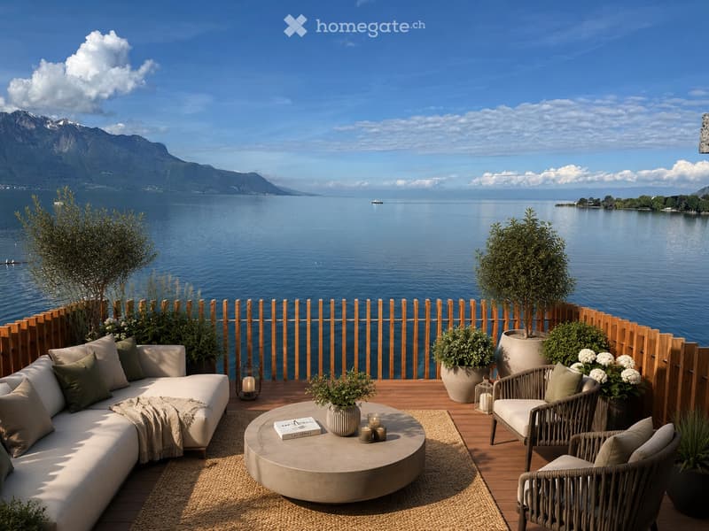 A luxurious balcony overlooking a lake with mountains in the background, featuring a sofa, coffee table, chairs, and decorative plants.