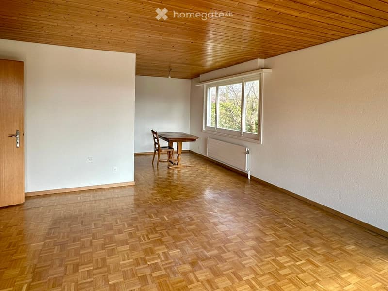 empty room, wooden floor, white walls, wooden door, wooden table, chair, window, radiator