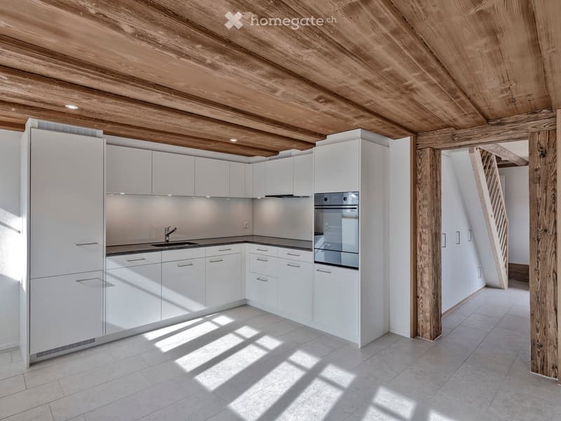 kitchen, white cabinets, wooden beams, granite countertops, stainless steel sink, integrated oven, dishwasher, tile flooring