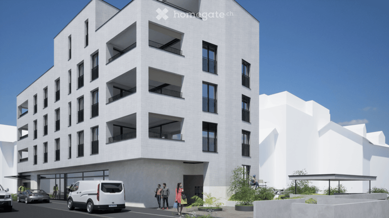 Modern multi-story residential building with white facade, balconies, and parking area.