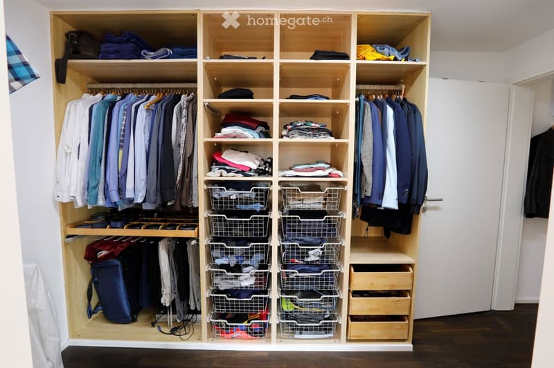 wooden wardrobe, racks, shelves, hanging clothes, drawers, wire baskets