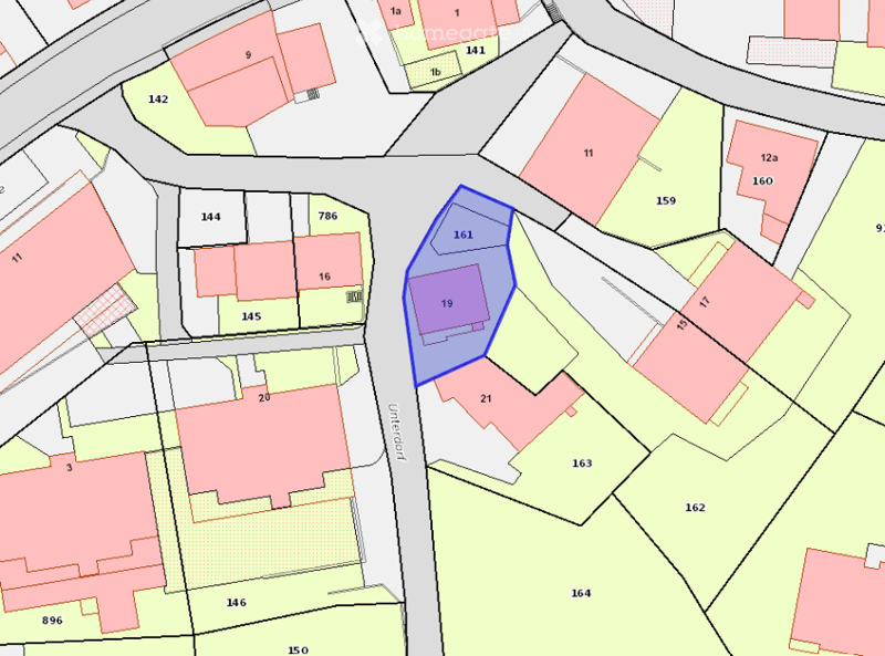 Floor plan showing multiple plots and buildings with numbered sections, including highlighted areas in blue and purple.