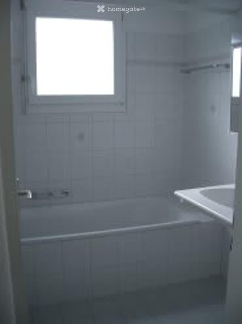 Bathroom with bathtub, sink, shower