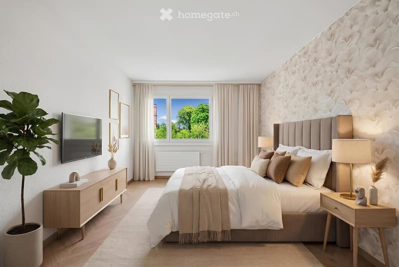 Modern bedroom with a large bed, nightstands, lamps, dresser, screen, plant, and picture frames. Large windows offer a view of greenery outside.