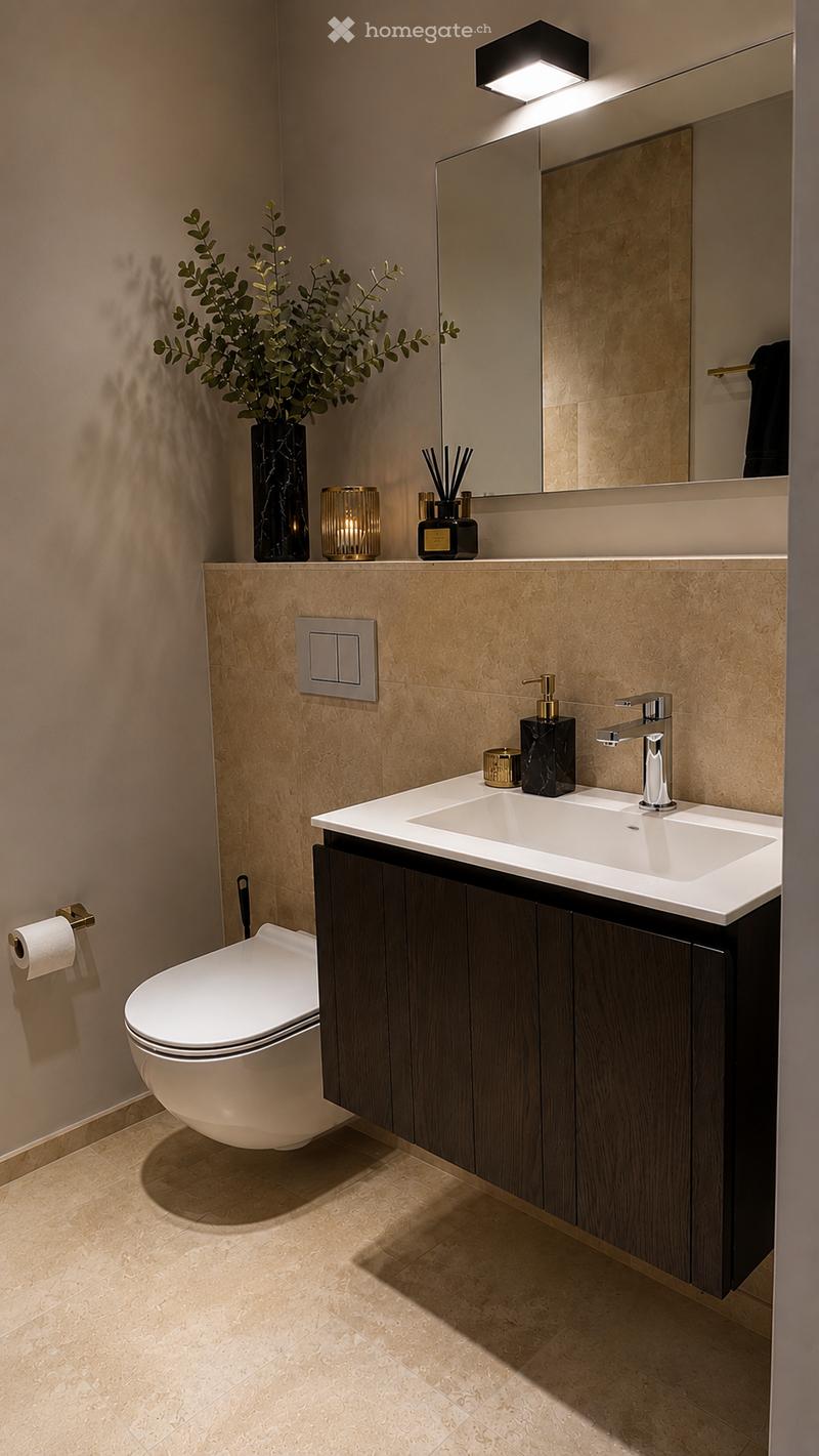 Modern bathroom with a floating vanity, double sink, sleek faucet, large mirror, and decorative items including a vase with greenery and candles.
