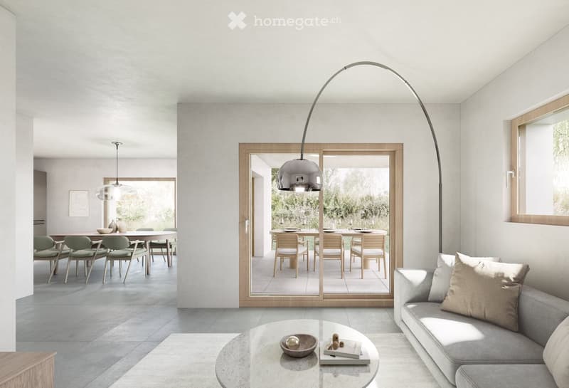 Modern living room with grey sofa, coffee table, floor lamp, and a dining area with a table and chairs visible through a large sliding glass door.